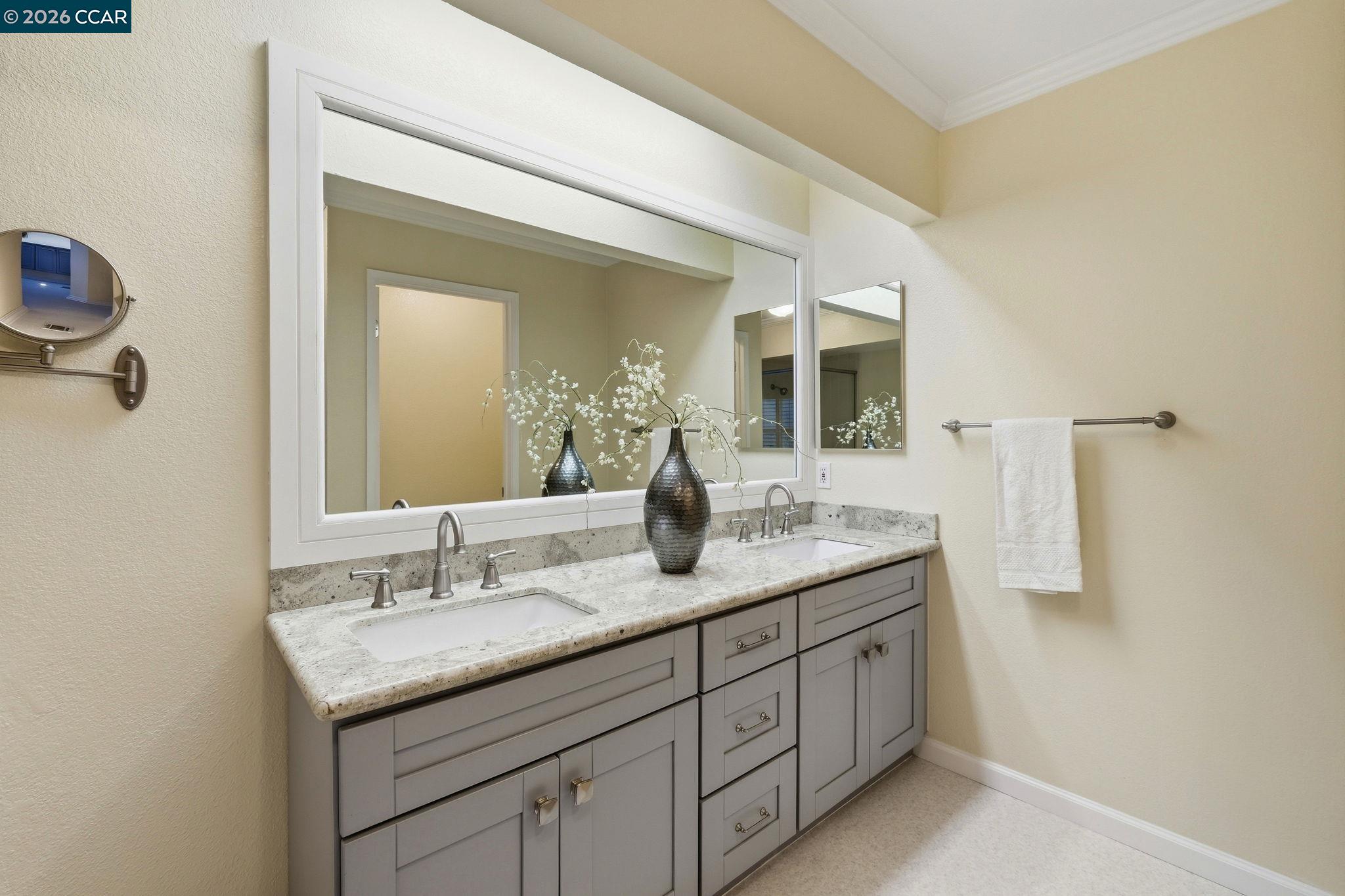 1707 Geary Road Walnut Creek, CA 94597 - Photo 27 of 43 a bathroom with a granite countertop sink and a mirror