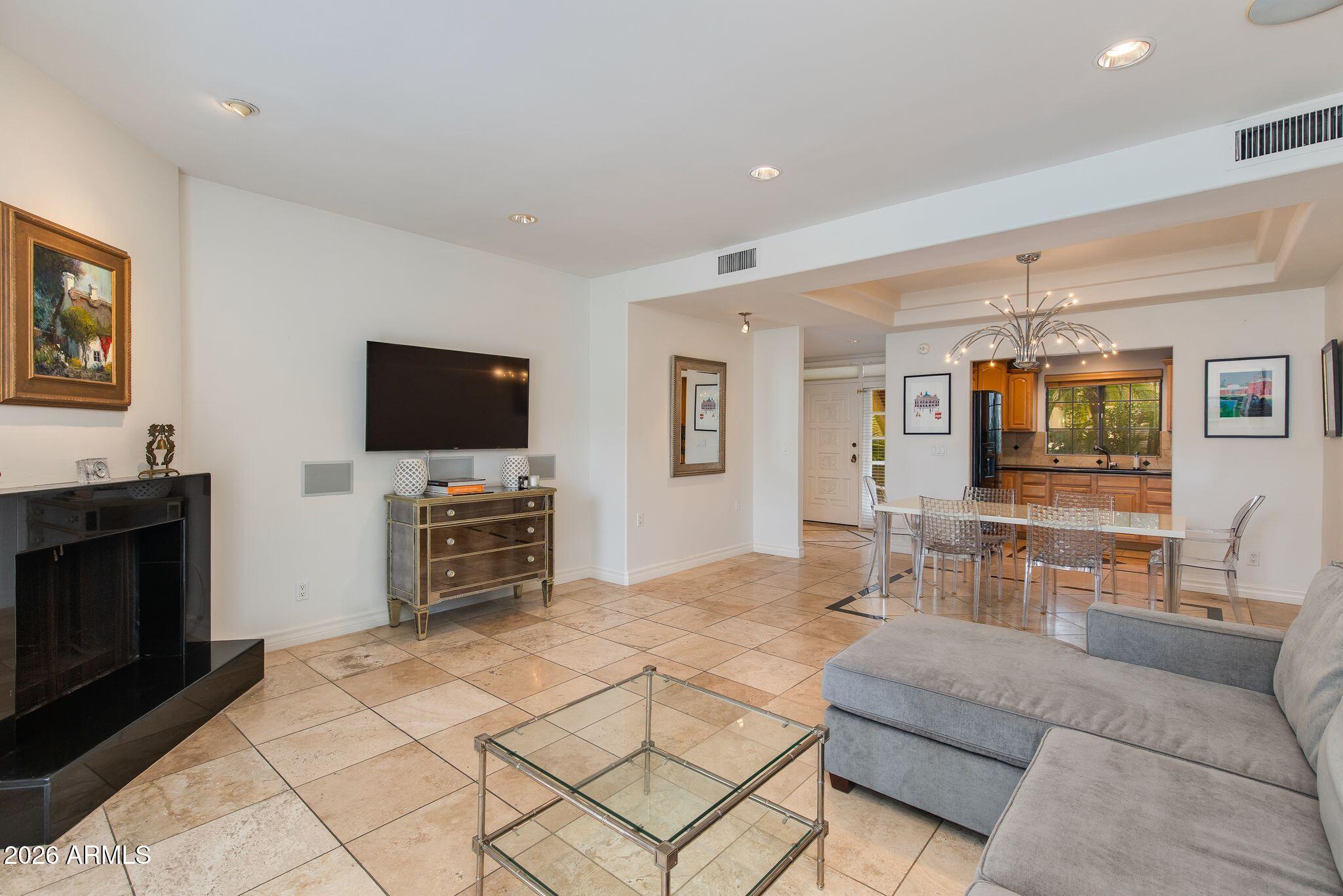 6227 North 30th Way Phoenix, AZ 85016 - Photo 3 of 16 a living room with furniture and a flat screen tv