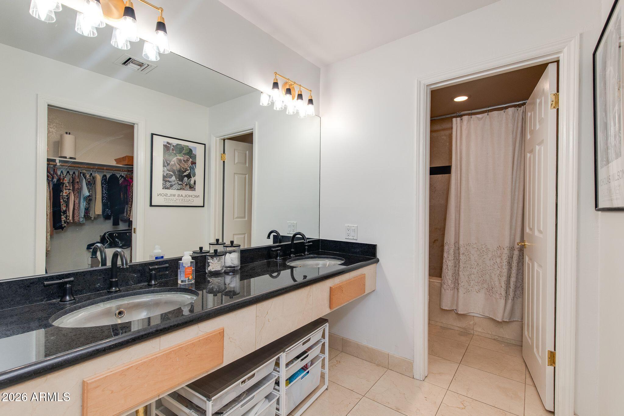 6227 North 30th Way Phoenix, AZ 85016 - Photo 6 of 16 a bathroom with a sink and a mirror