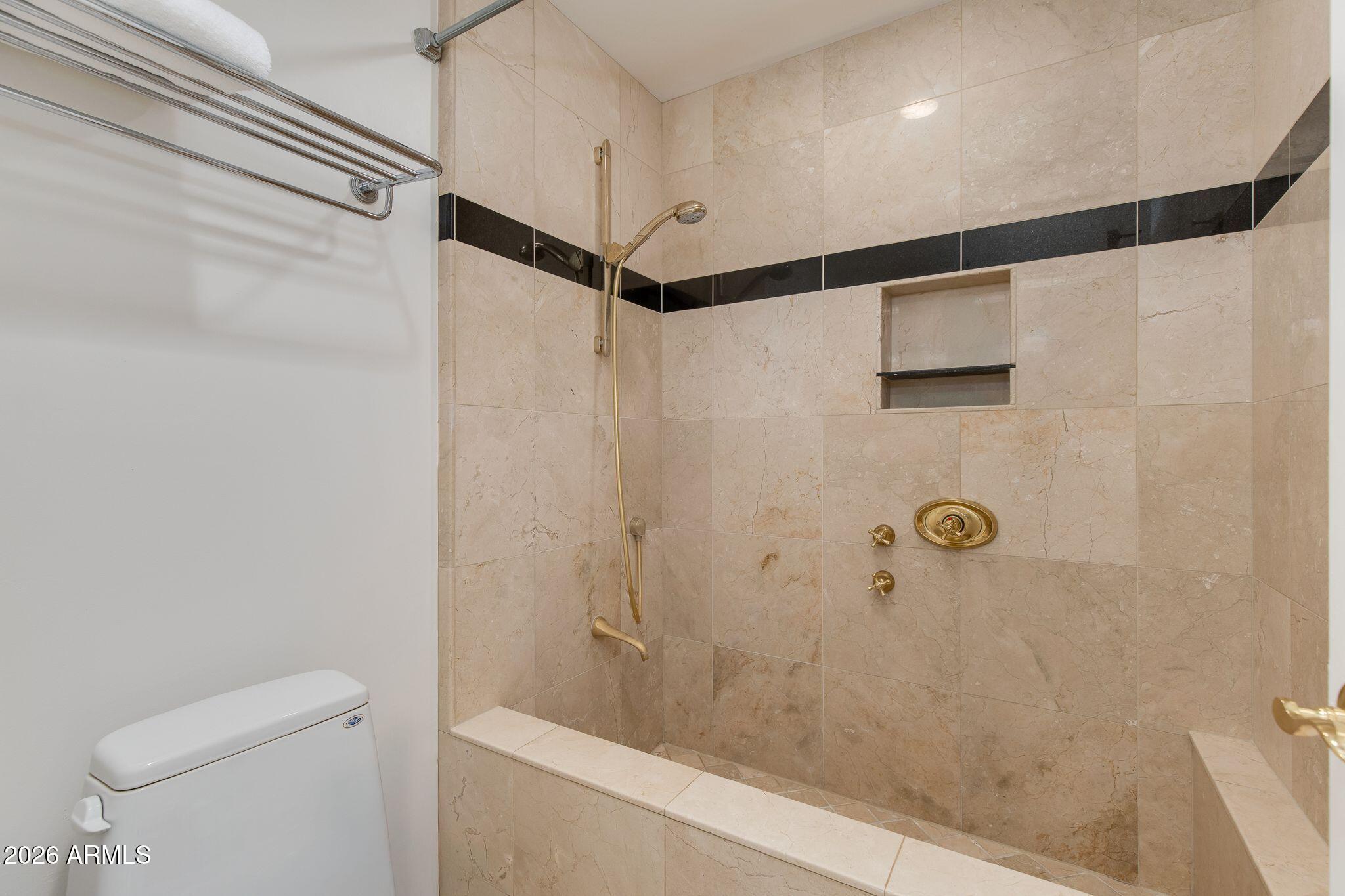 6227 North 30th Way Phoenix, AZ 85016 - Photo 7 of 16 a bathroom with a shower and a toilet
