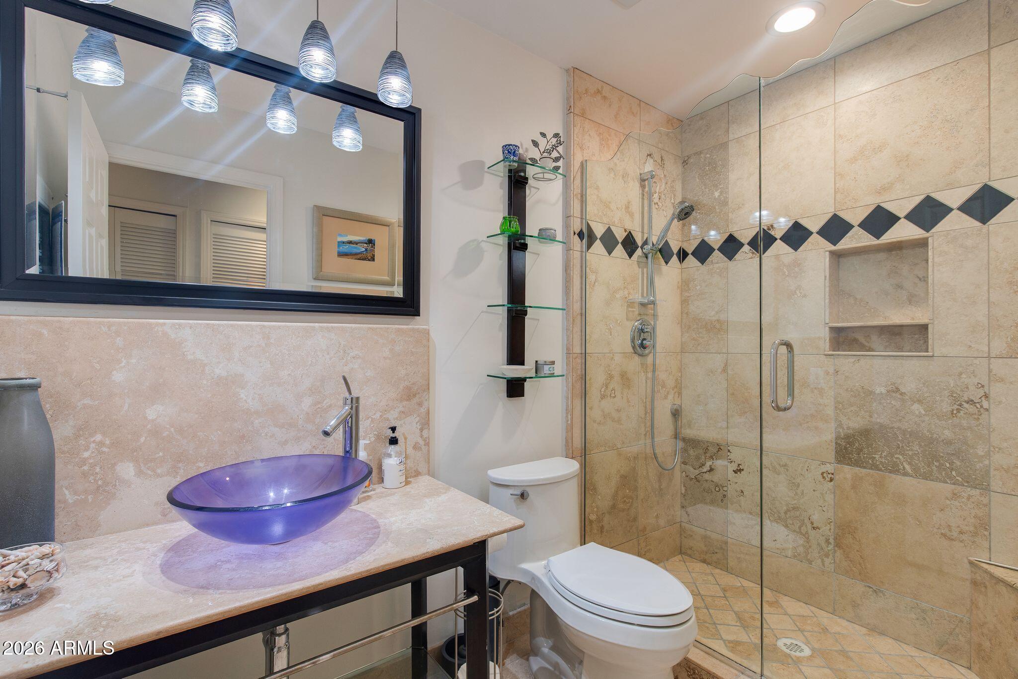 6227 North 30th Way Phoenix, AZ 85016 - Photo 9 of 16 a bathroom with a sink toilet and shower