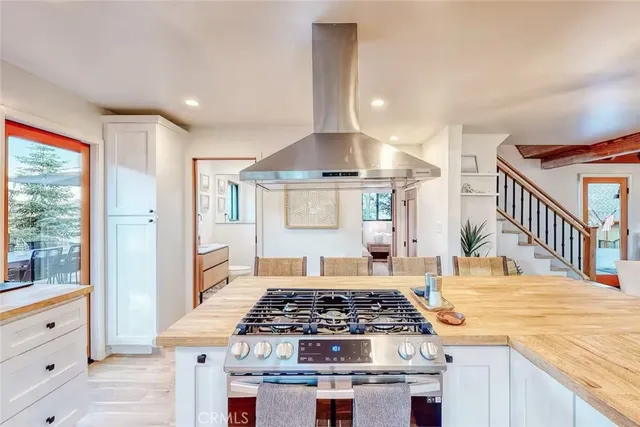 a kitchen with stainless steel appliances granite countertop a stove and a sink