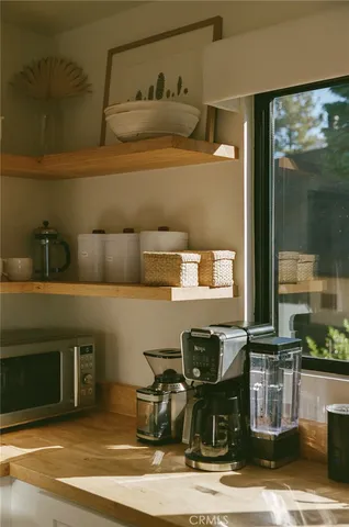 a view of a roof deck with potted plants