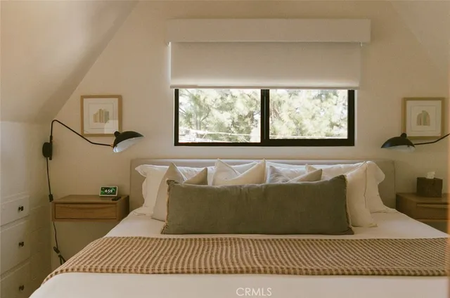 a living room with a fireplace and a flat screen tv