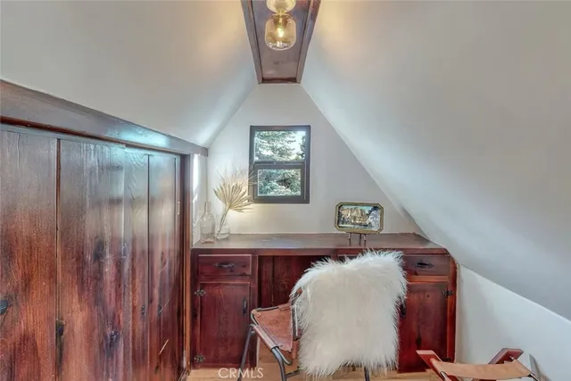 an aerial view of lake and mountain