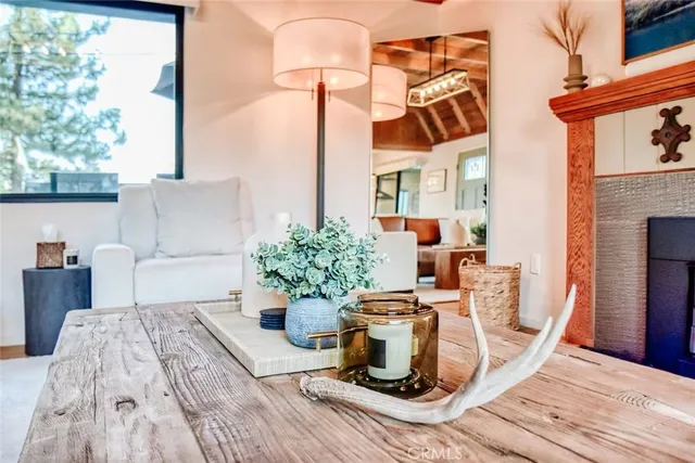 a dining room with furniture and wooden floor
