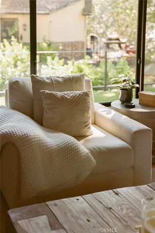 a bed sitting in a bedroom next to a large window with lake view