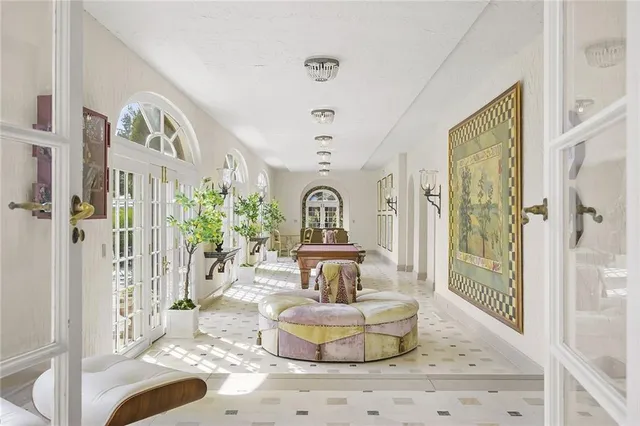 a living room with a couch and a chandelier