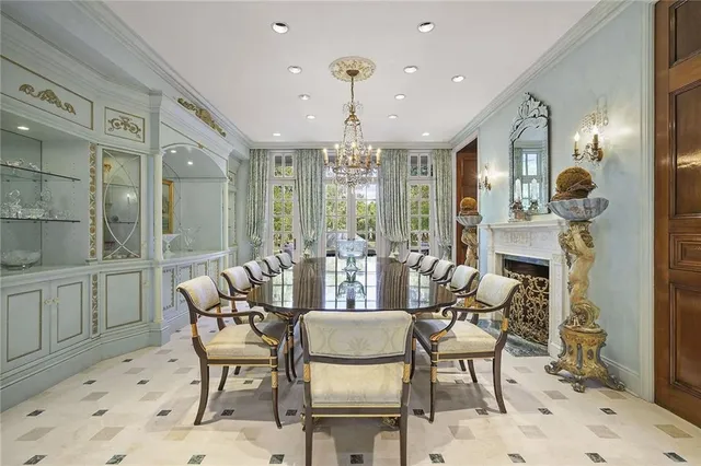 a view of a dining room with furniture wooden floor and chandelier