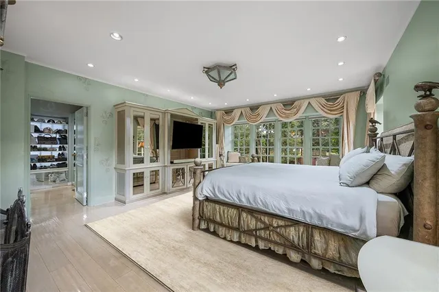 a spacious bathroom with a bathtub and shower