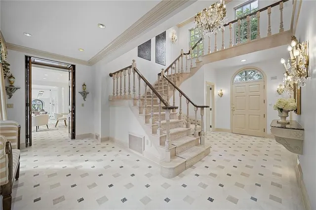 a view of entryway and hall with a front door