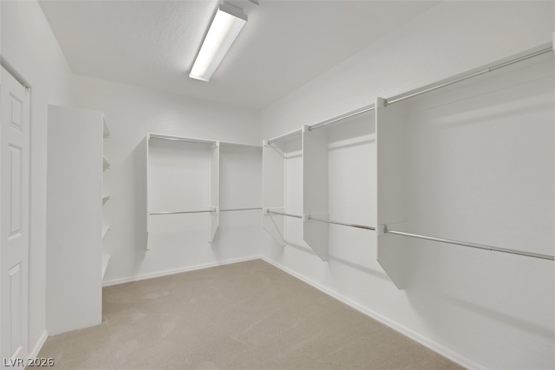 2501 Bechamel Place Henderson, NV 89044 - Photo 41 of 50 Ample storage solutions define this practical walk-in closet.