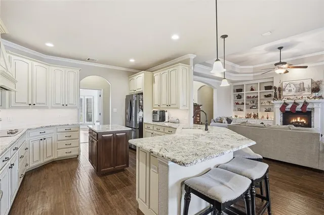 a open kitchen with stainless steel appliances granite countertop a stove and cabinets