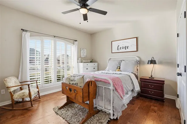 a spacious bedroom with a bed a couch and a window