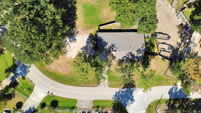 a view of a yard with potted plants
