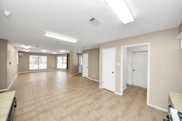 a view of an empty room and window