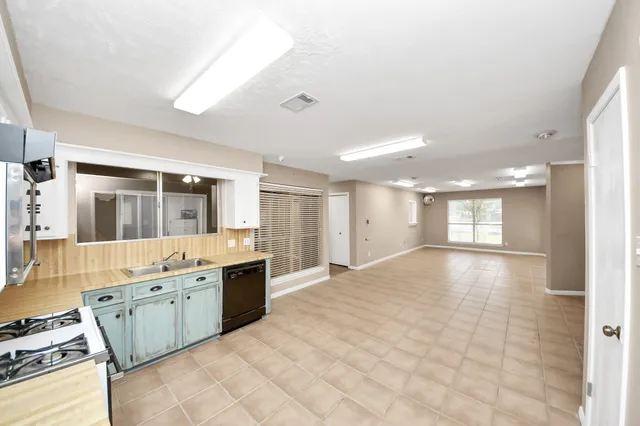 a large bathroom with a large tub sink shower and mirror