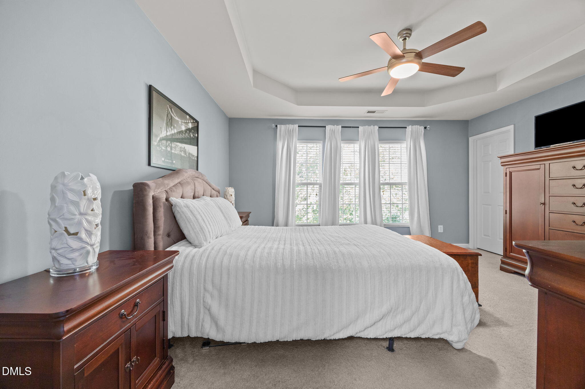 7022 Racine Way Raleigh, NC 27690 - Photo 14 of 26 a bedroom with a large bed and a window