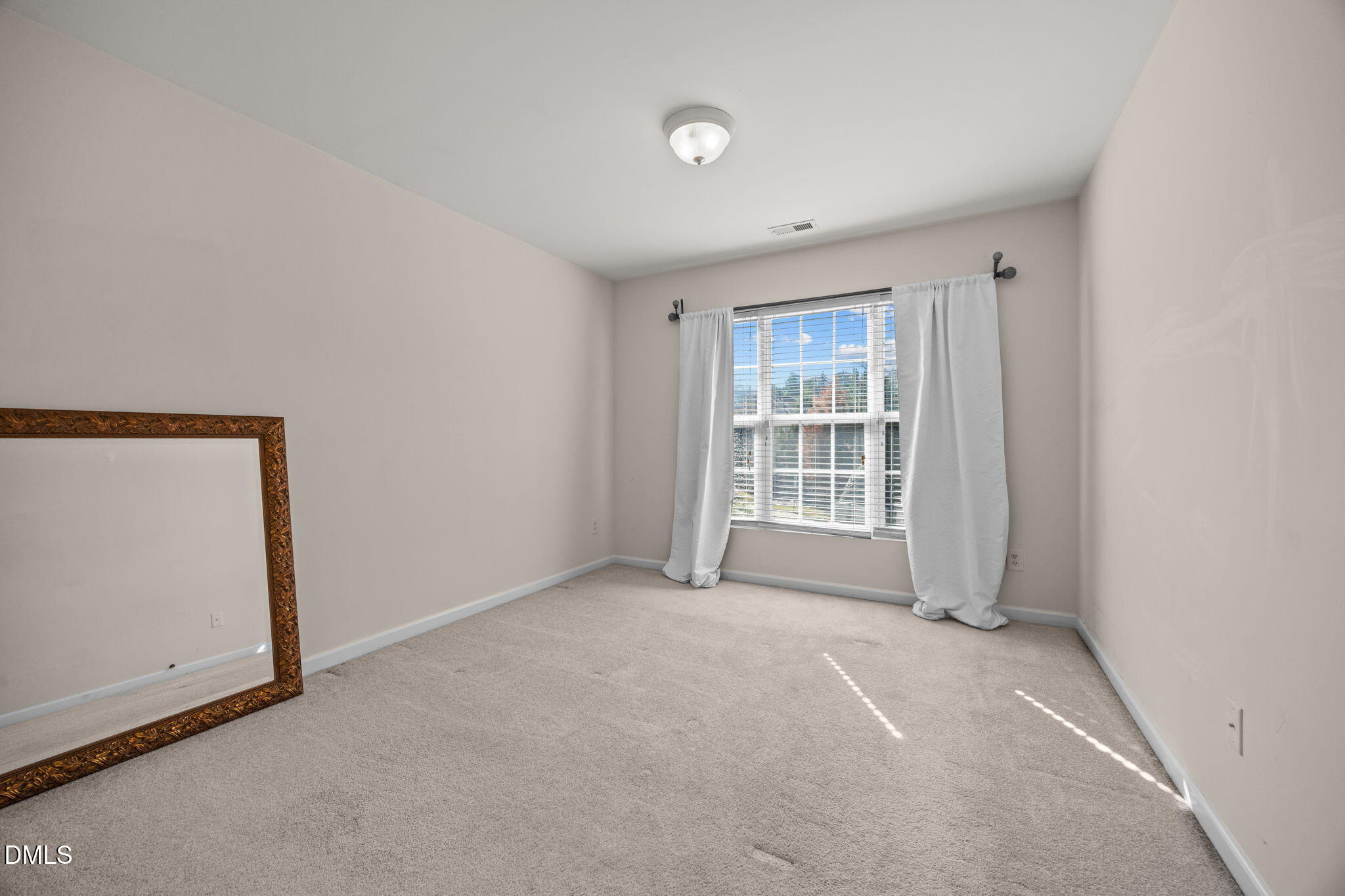7022 Racine Way Raleigh, NC 27690 - Photo 20 of 26 a view of an empty room with a window
