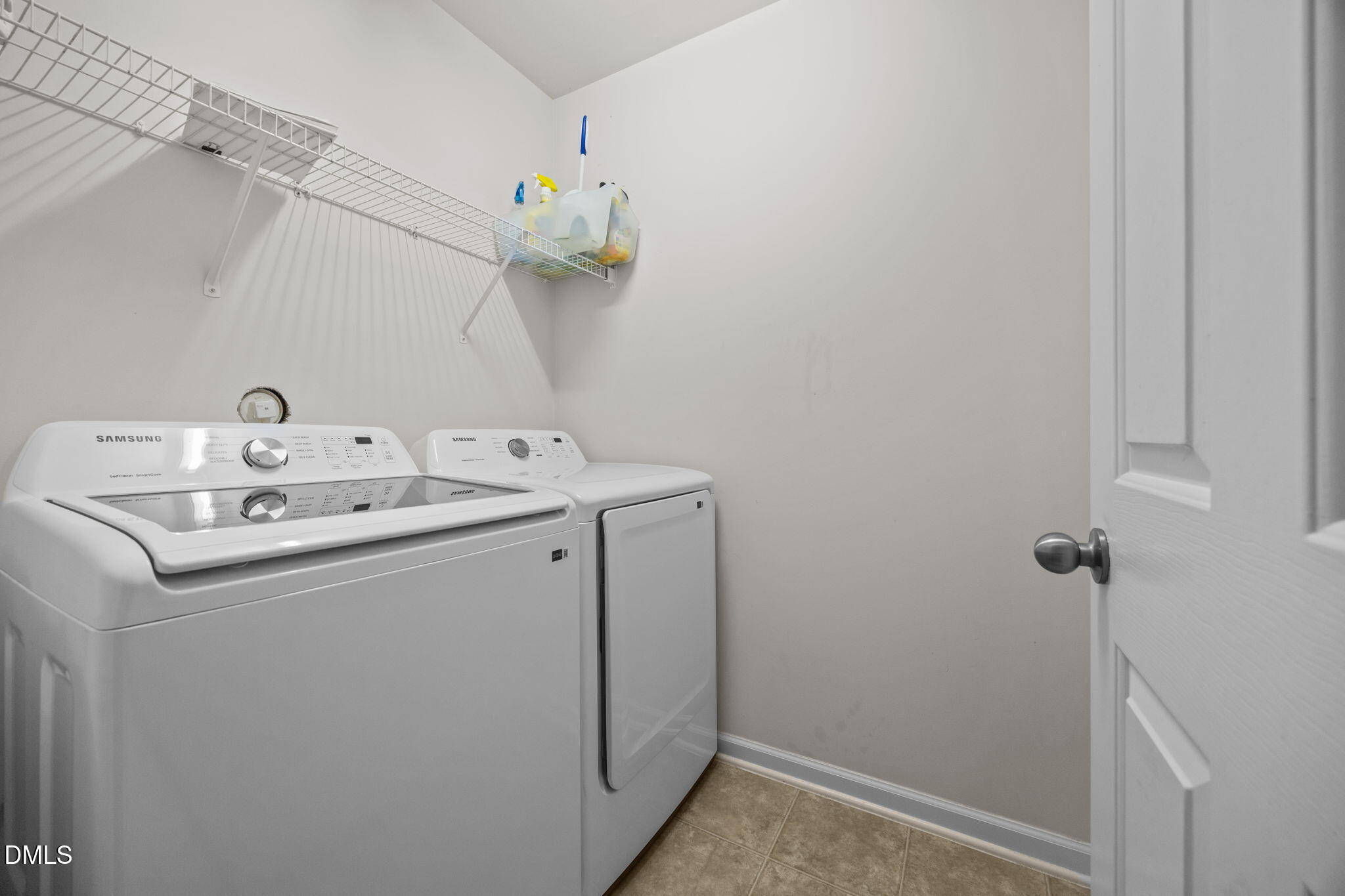 7022 Racine Way Raleigh, NC 27690 - Photo 22 of 26 a utility room with dryer and washer