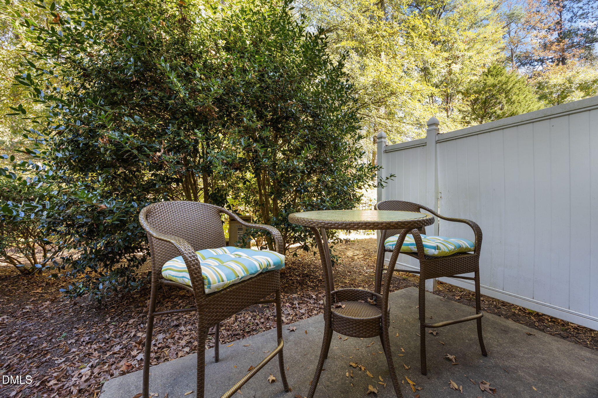 7022 Racine Way Raleigh, NC 27690 - Photo 23 of 26 a patio with table and chairs and potted plants