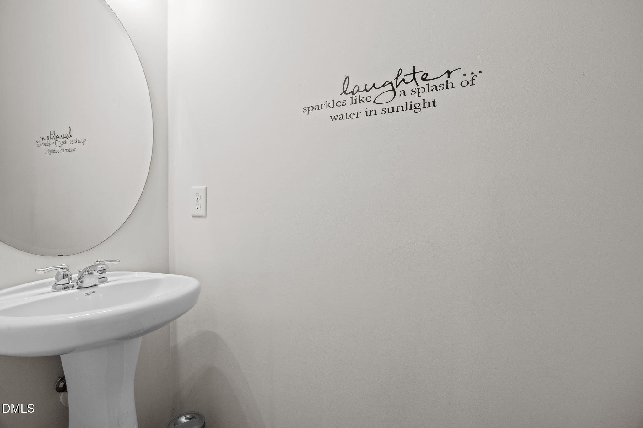 7022 Racine Way Raleigh, NC 27690 - Photo 5 of 26 a bathroom with a sink and a mirror