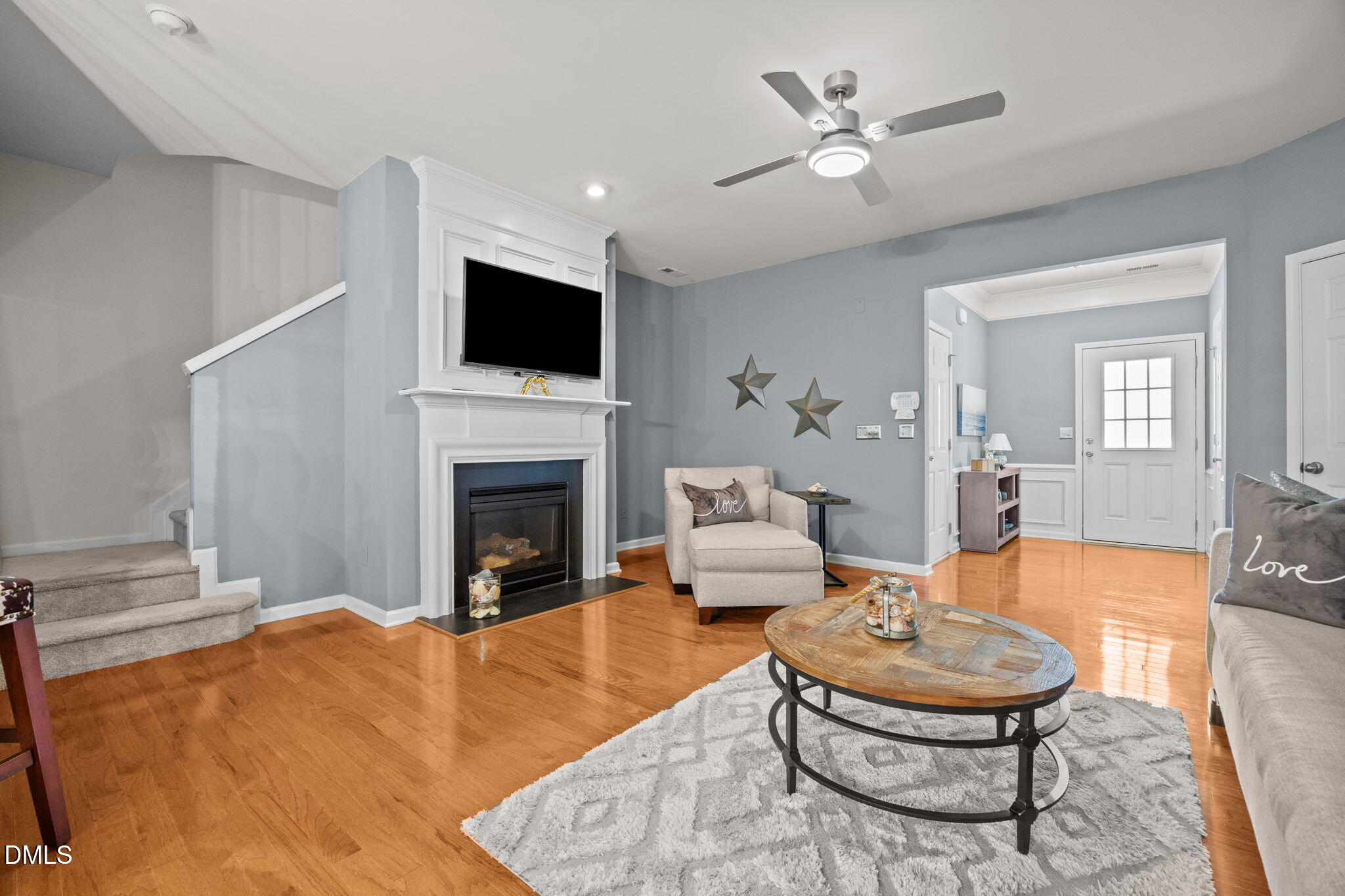 7022 Racine Way Raleigh, NC 27690 - Photo 6 of 26 a living room with furniture and a fireplace