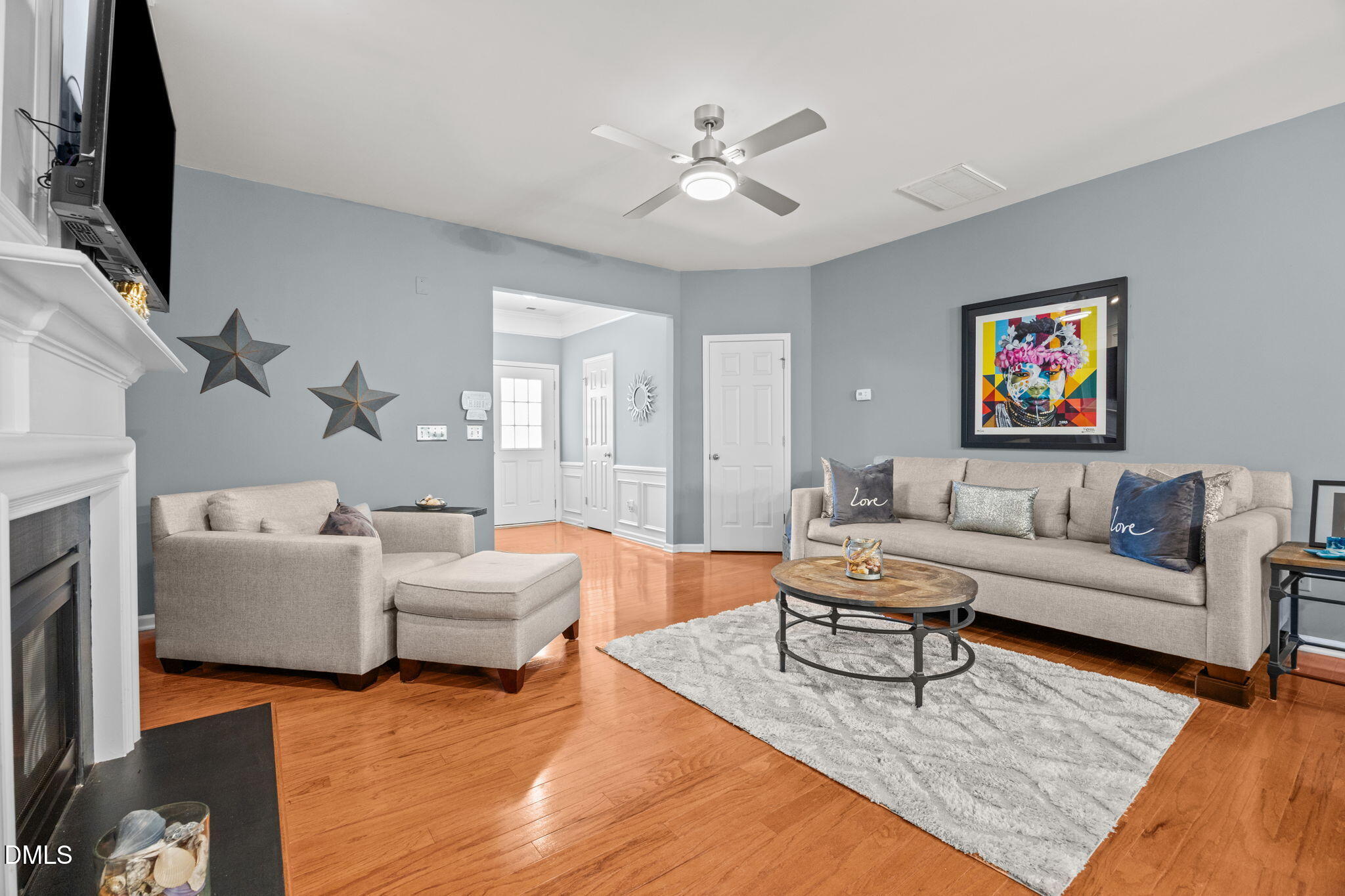 7022 Racine Way Raleigh, NC 27690 - Photo 7 of 26 a living room with furniture and a flat screen tv