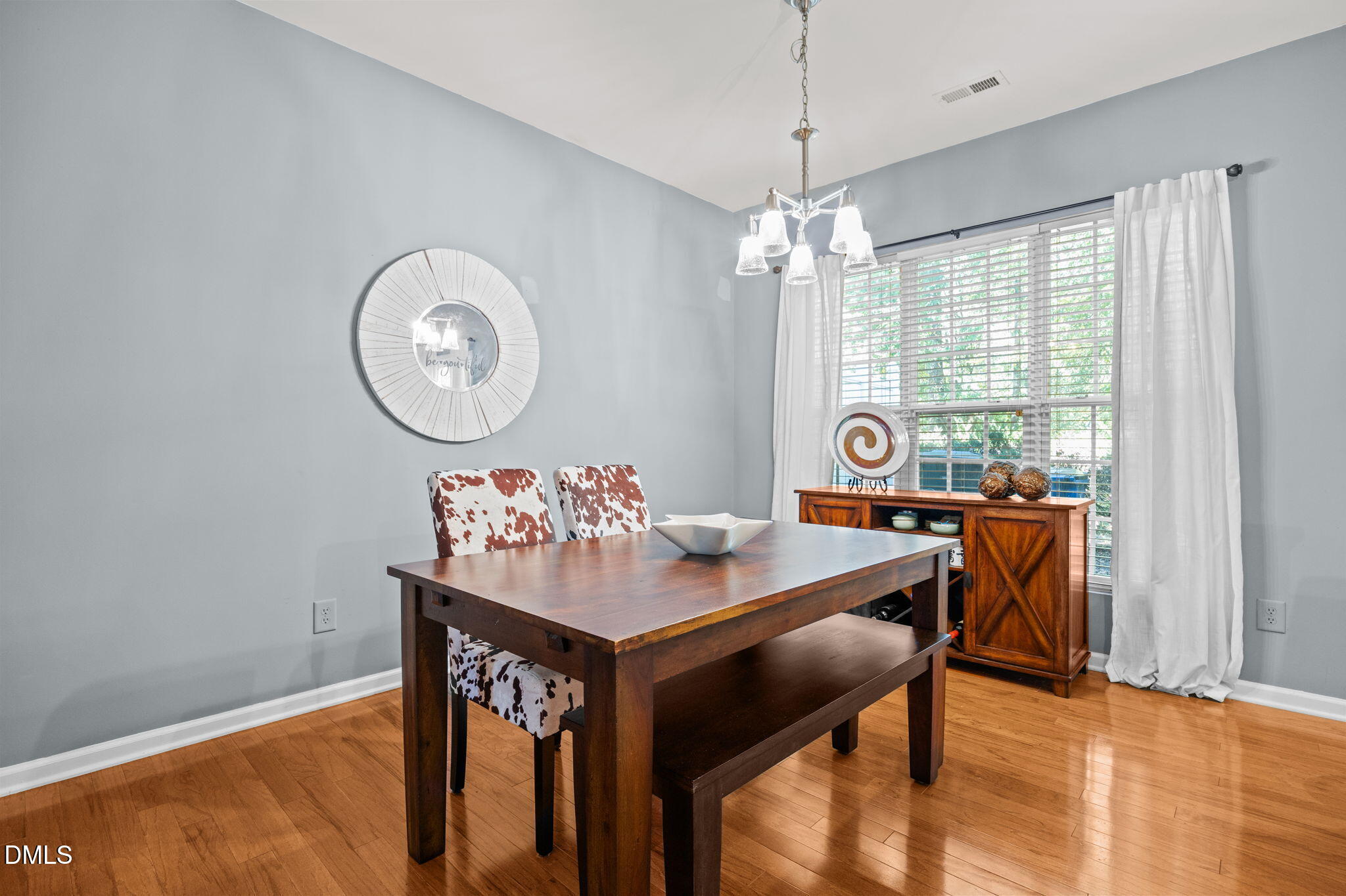 7022 Racine Way Raleigh, NC 27690 - Photo 8 of 26 a view of a dining room with furniture window and outside view