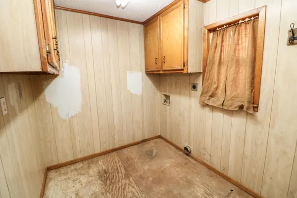 a view of a closet area with an entryway