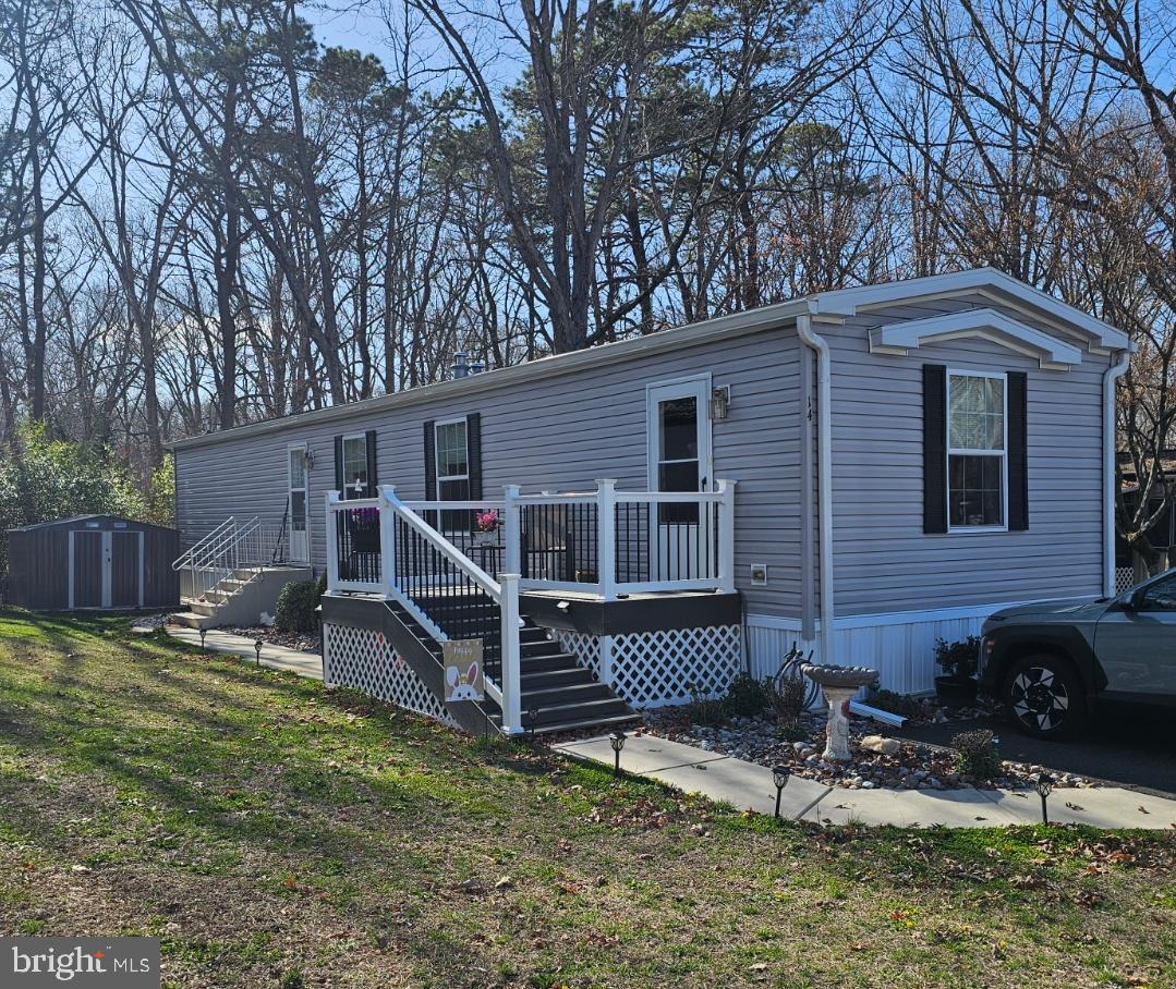 2110 Mays Landing Road, Unit 14 Millville, NJ 08332 - Photo 1 of 12 a backyard of a house with seating space