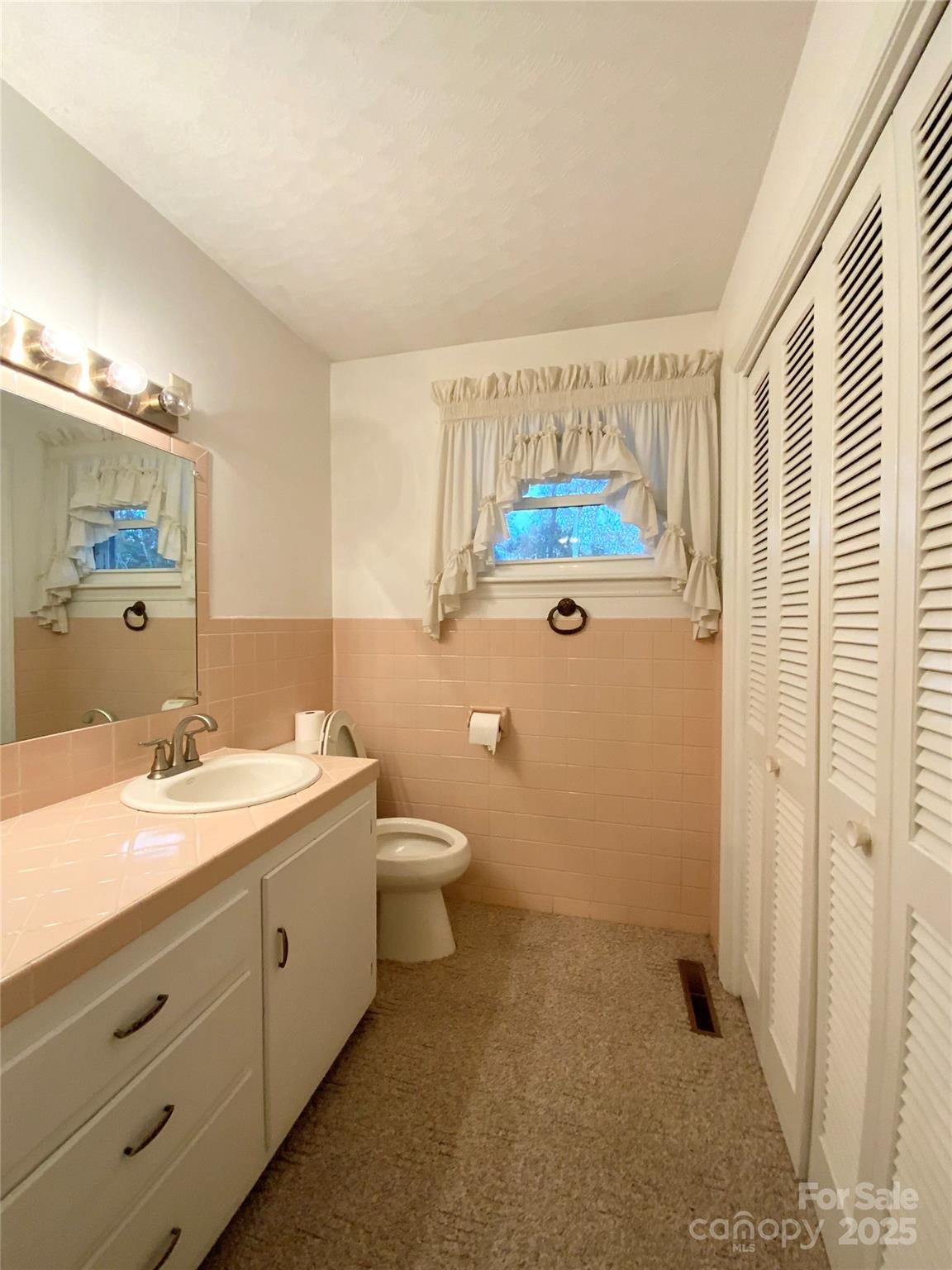 167 East High Road Bostic, NC 28018 - Photo 17 of 28 a bathroom with a granite countertop sink mirror vanity and toilet