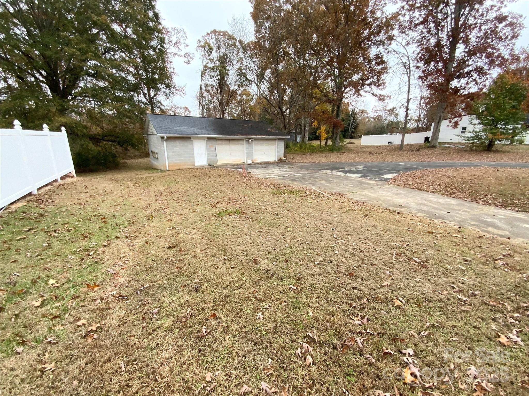167 East High Road Bostic, NC 28018 - Photo 20 of 28 a front view of a house with a yard and garage