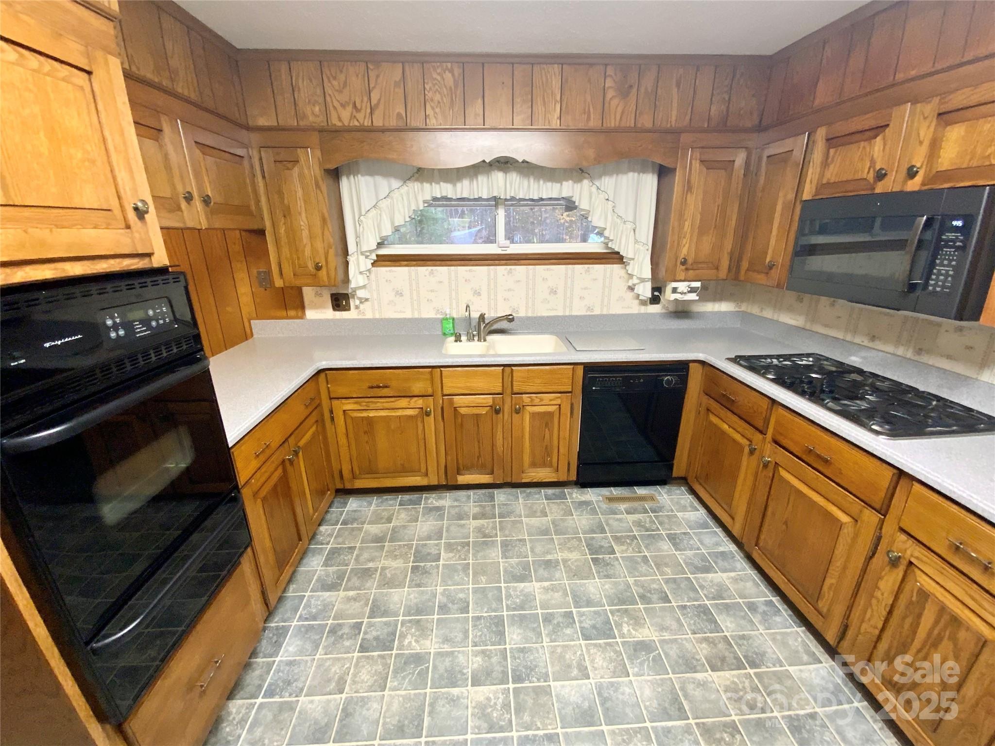 167 East High Road Bostic, NC 28018 - Photo 7 of 28 a kitchen with a sink stove and cabinets
