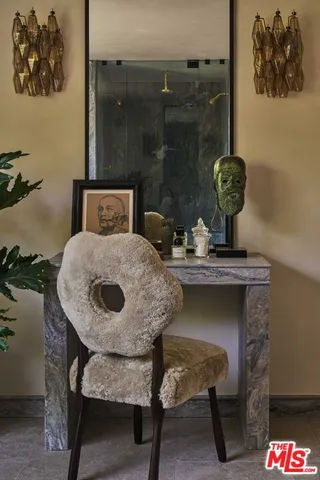 a bedroom with bed and a potted plant