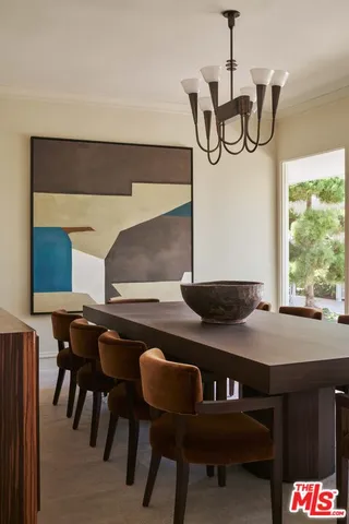 a view of a dining room with furniture and window