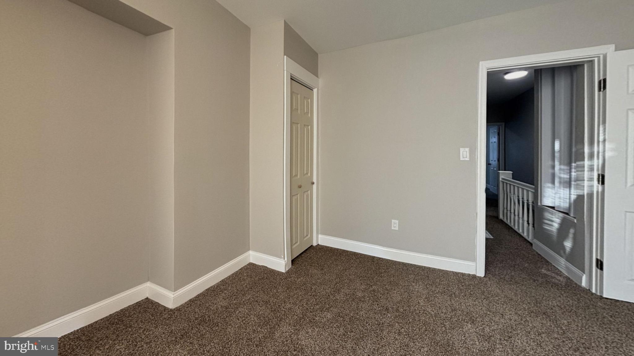 2527 South Felton Street Philadelphia, PA 19142 - Photo 5 of 11 an empty room with an entrance and door