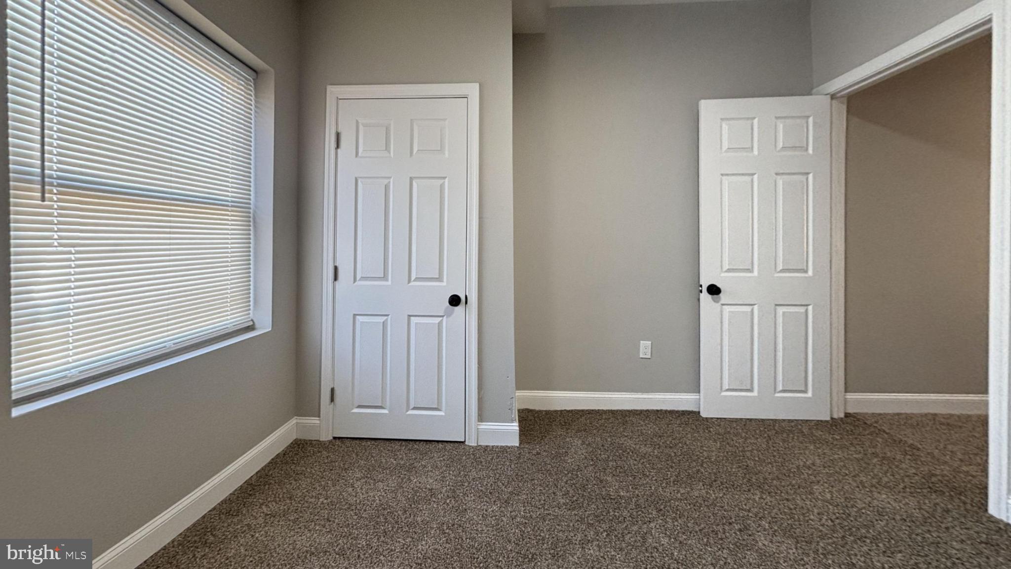 2527 South Felton Street Philadelphia, PA 19142 - Photo 8 of 11 an empty room that has a window in it