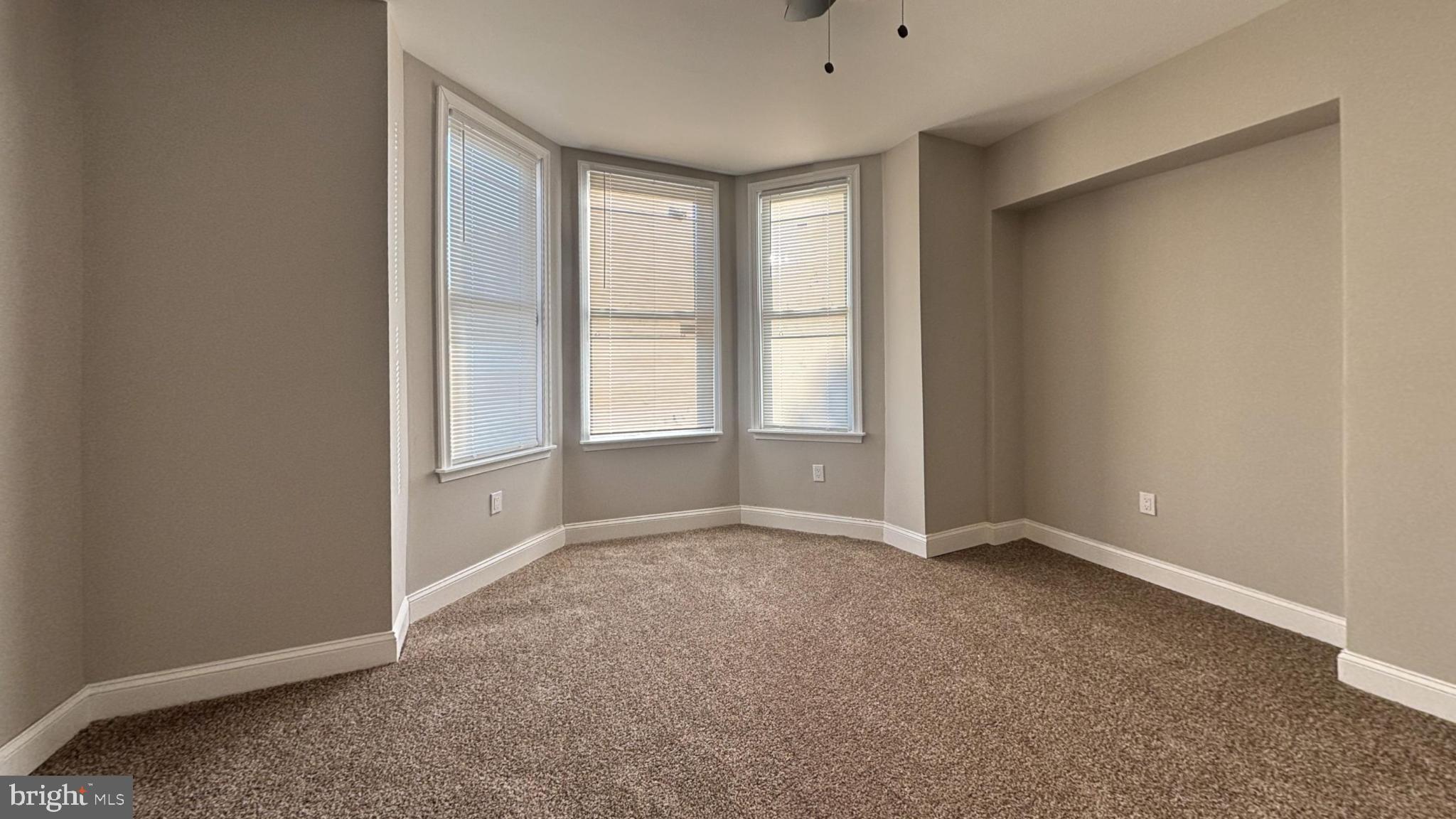2527 South Felton Street Philadelphia, PA 19142 - Photo 9 of 11 an empty room with windows