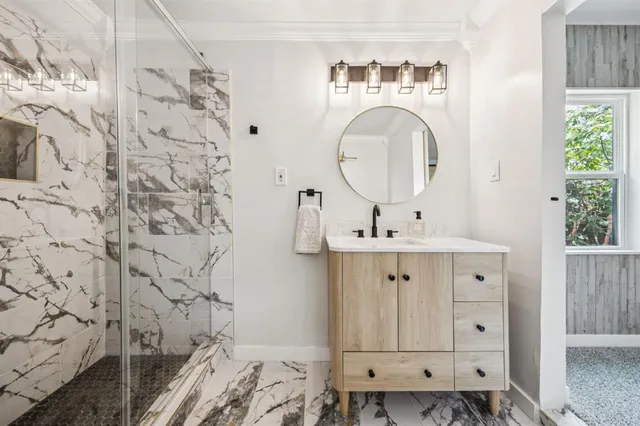 a bathroom with a sink a vanity and a mirror