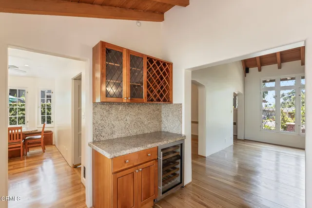a view of kitchen with cabinets and wooden floor