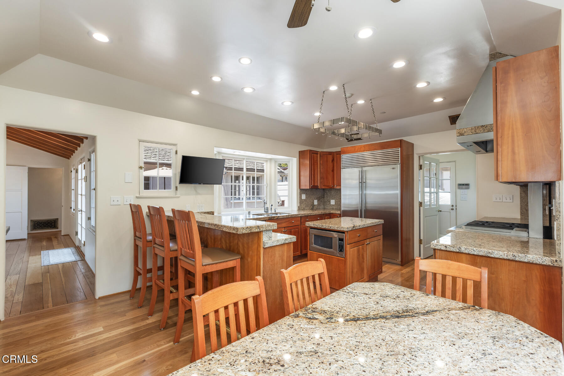 369 West Kenneth Road Glendale, CA 91202 - Photo 15 of 36 a kitchen with stainless steel appliances kitchen island granite countertop a sink and cabinets