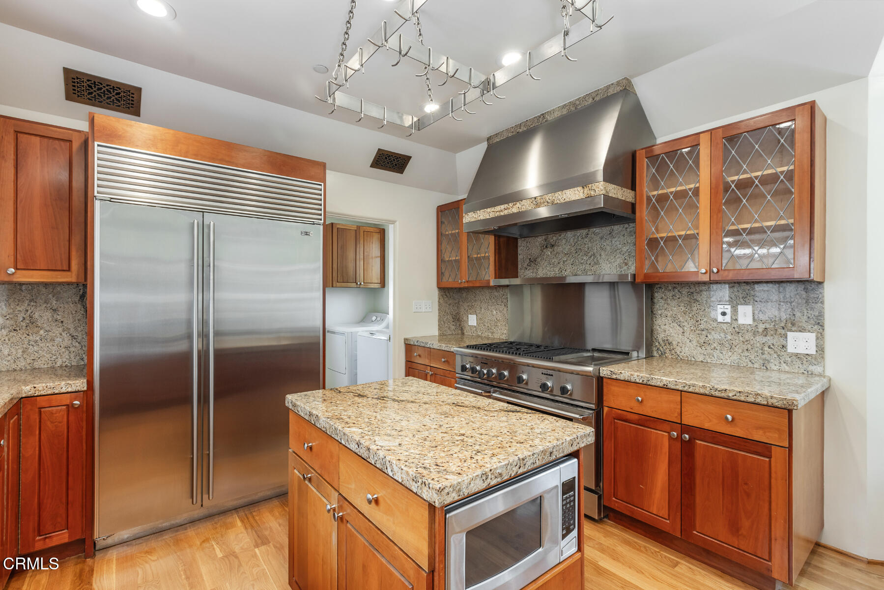 369 West Kenneth Road Glendale, CA 91202 - Photo 17 of 36 a kitchen with stainless steel appliances granite countertop a stove and a refrigerator