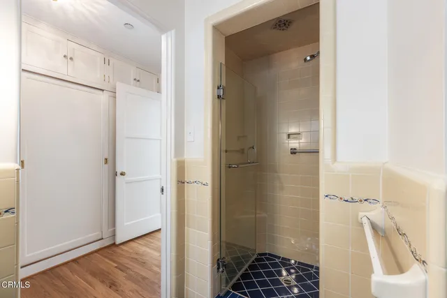 a bathroom with a bathtub and shower