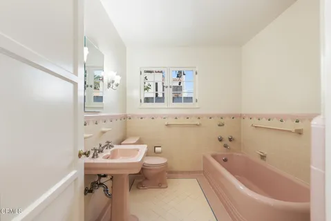 a bathroom with a sink a toilet and a bathtub