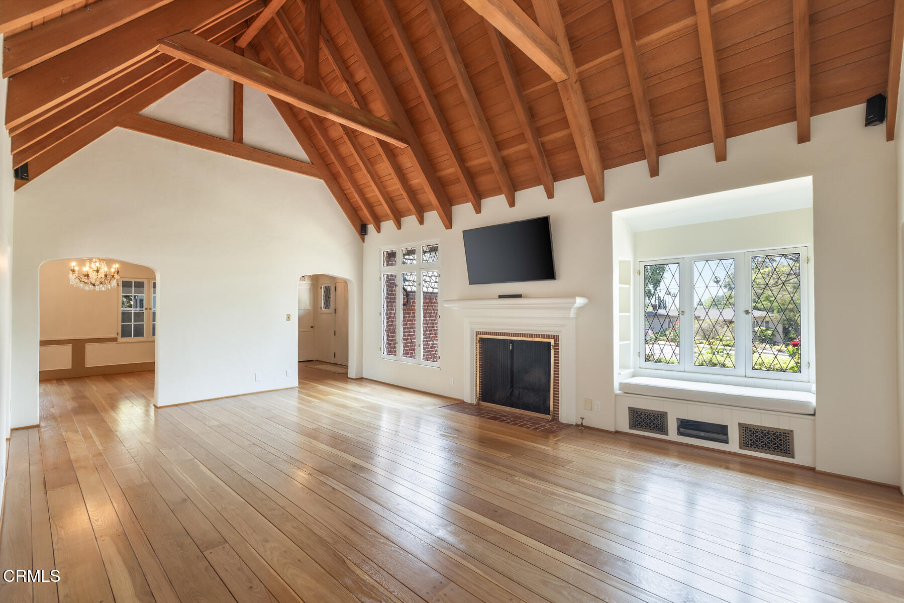 369 West Kenneth Road Glendale, CA 91202 - Photo 8 of 36 a view of empty room with wooden floor and fireplace