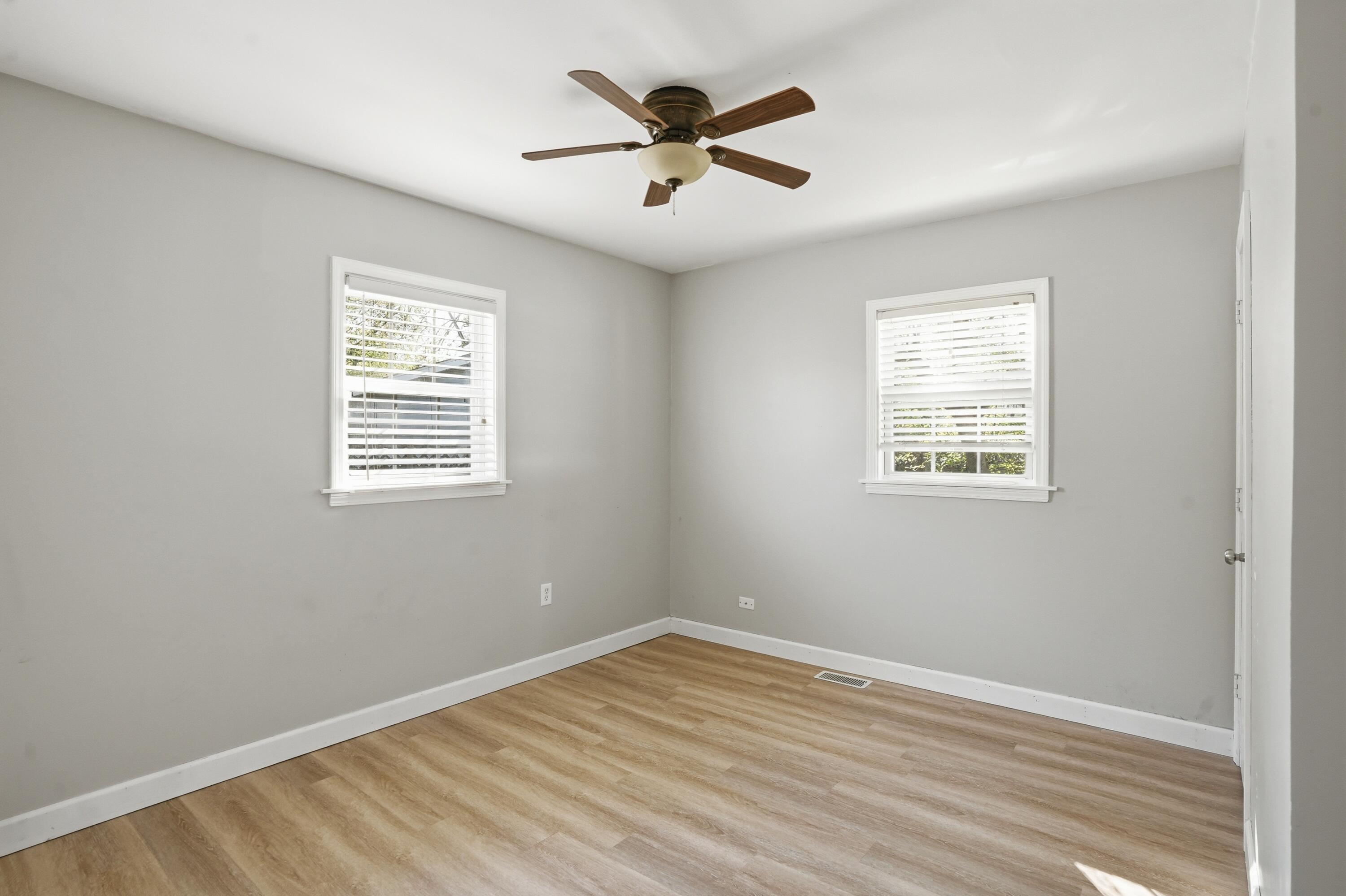 316 Oak Circle Crown Point, IN 46307 - Photo 12 of 19 an empty room with wooden floor and windows