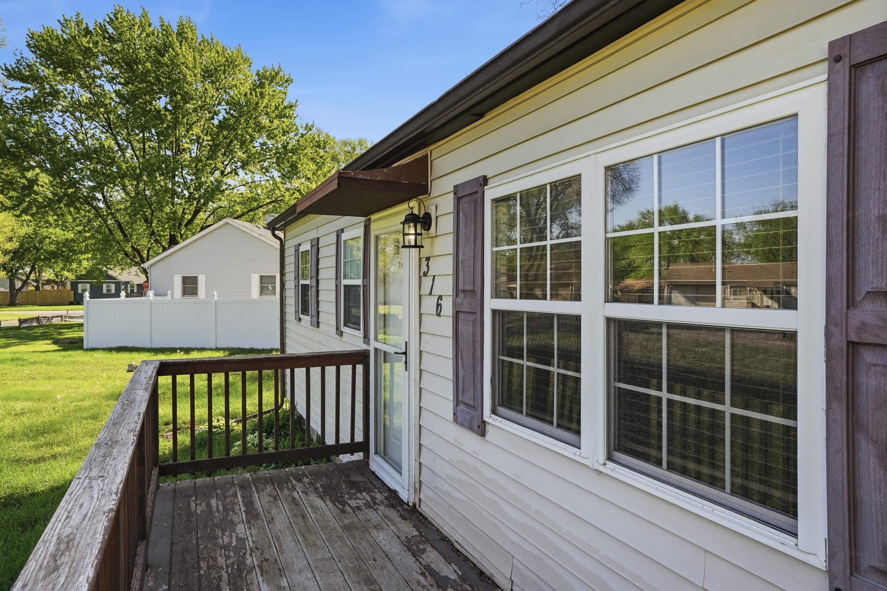 316 Oak Circle Crown Point, IN 46307 - Photo 15 of 19 a view of a house with a large window and wooden floor