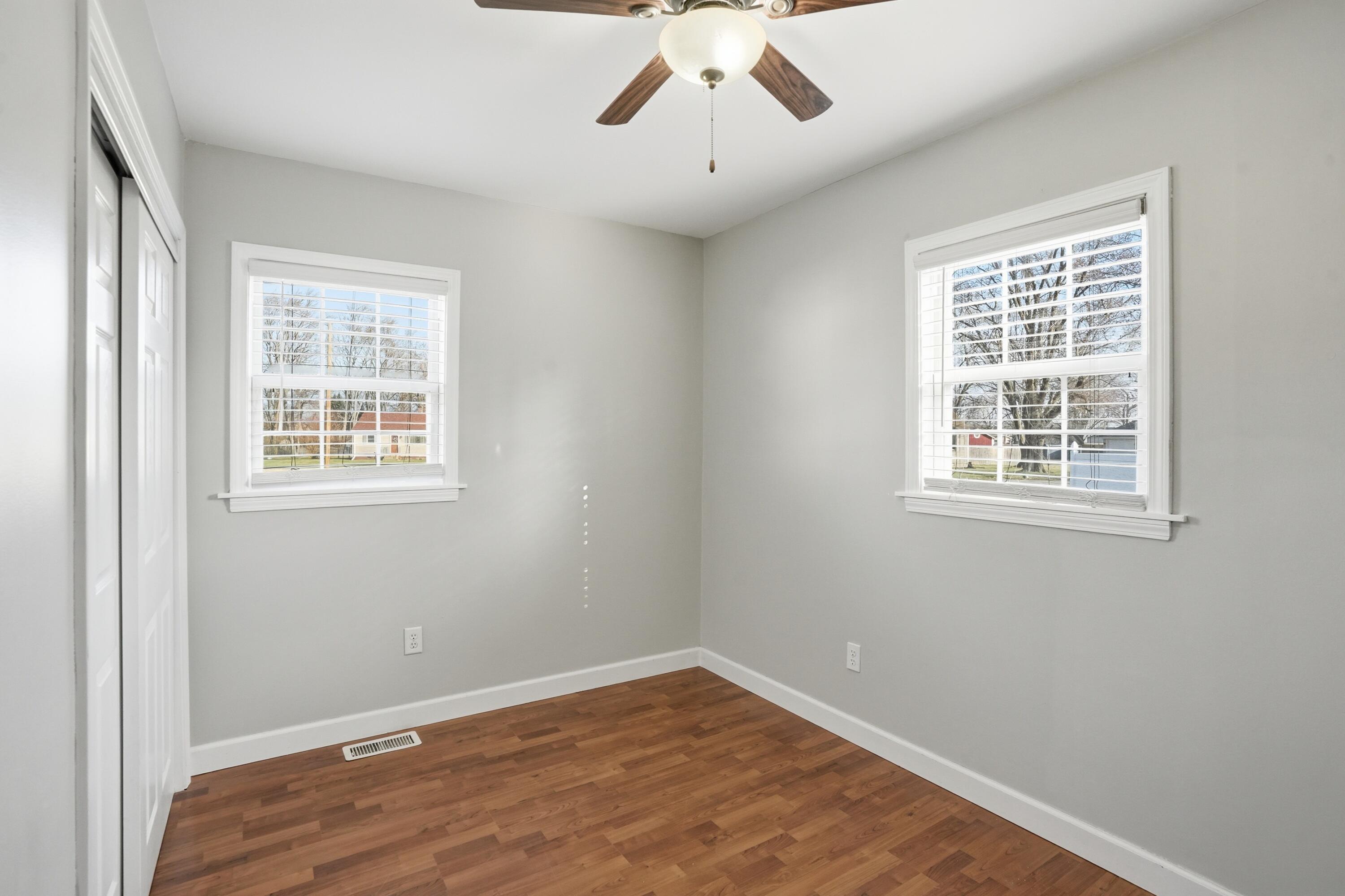 316 Oak Circle Crown Point, IN 46307 - Photo 16 of 19 a view of an empty room with wooden floor and a window