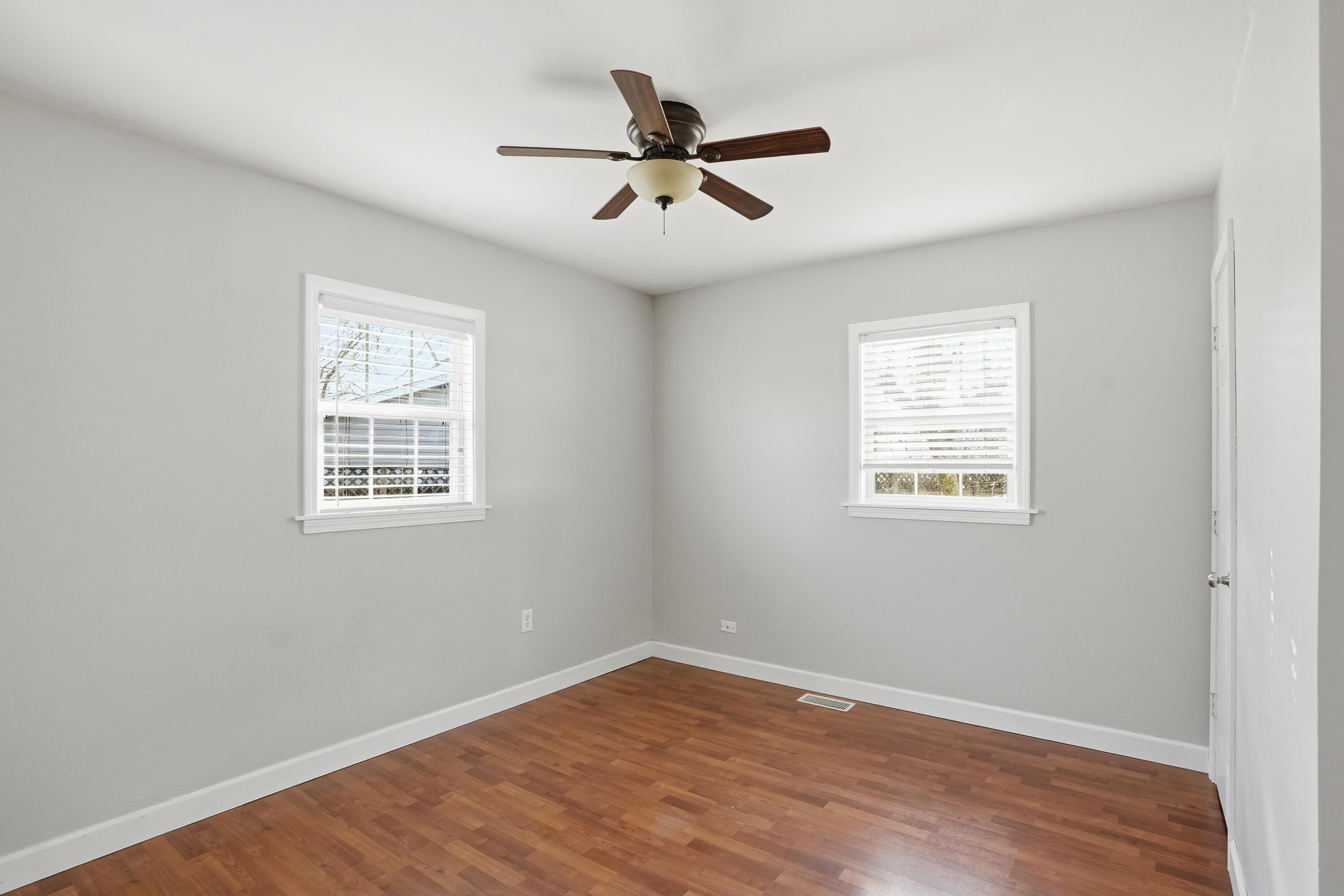 316 Oak Circle Crown Point, IN 46307 - Photo 17 of 19 wooden floor in an empty room with a window